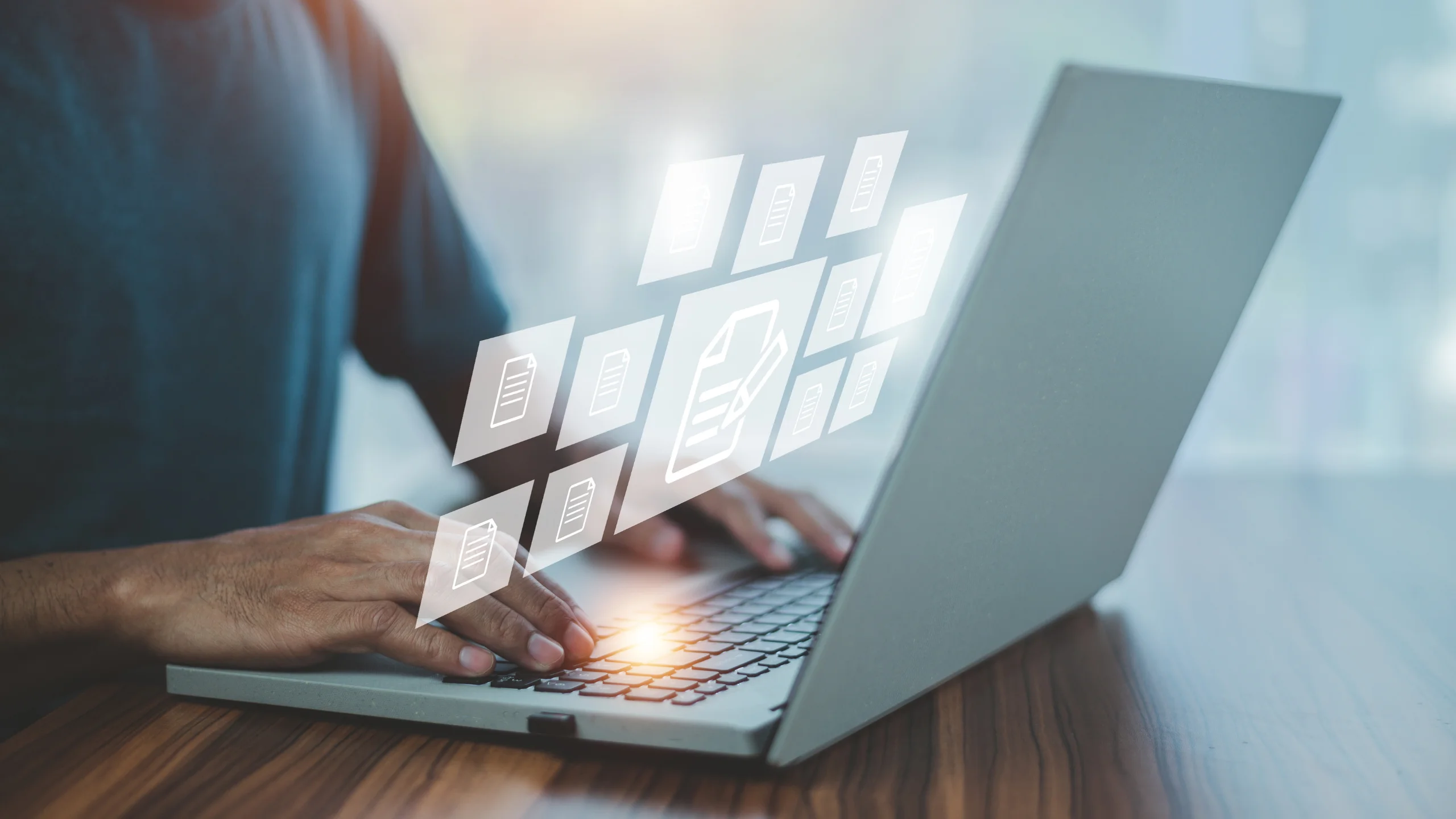 Professional using business management software on a laptop